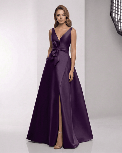 Celestia Maxi Dress - elegant purple satin A-line dress with wrap slit, bow waist, perfect for formal occasions by Lauven.