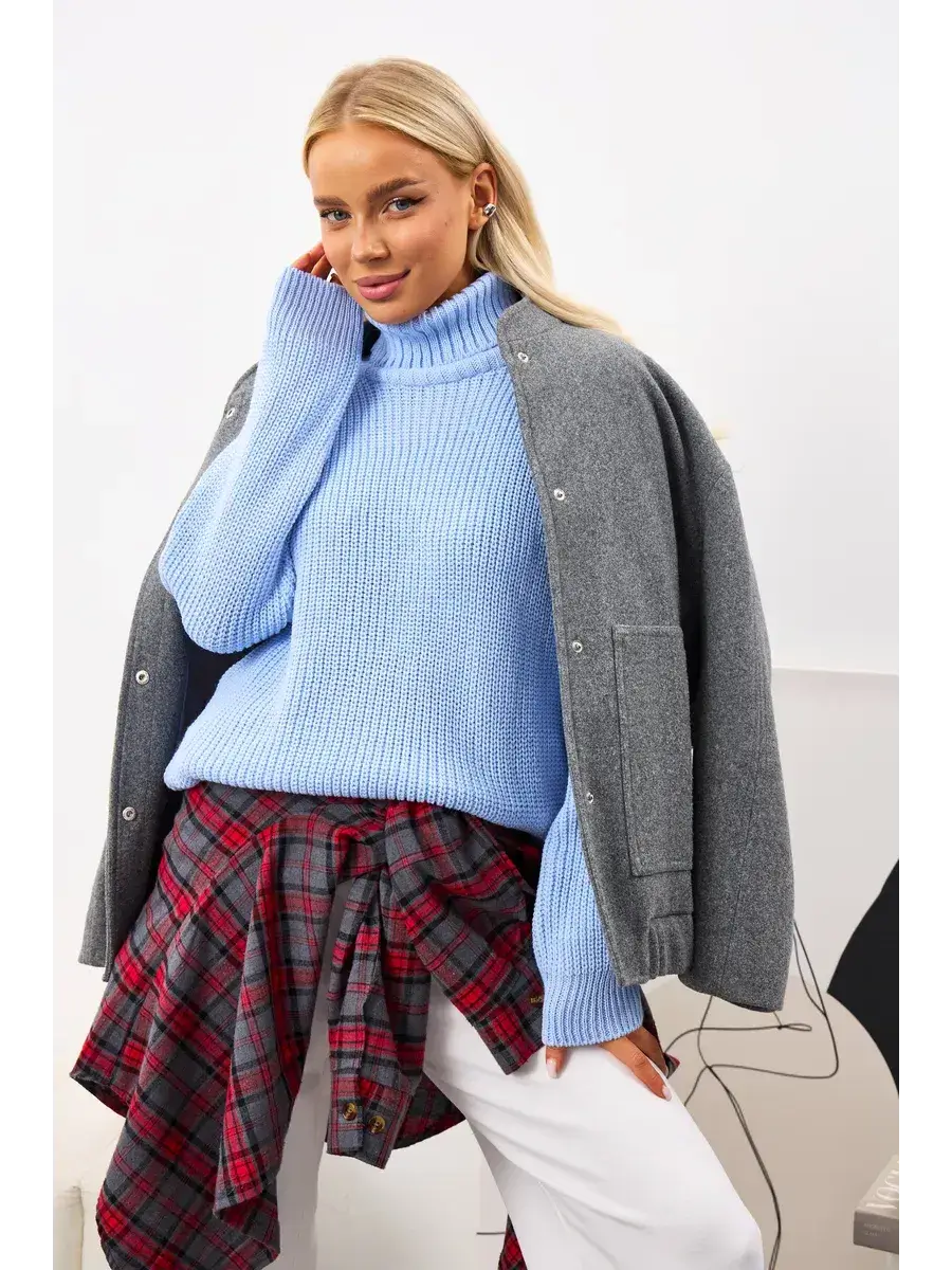 Celia Sweater by Lauven, oversized light blue knit with turtleneck, styled for a chic and cozy look.