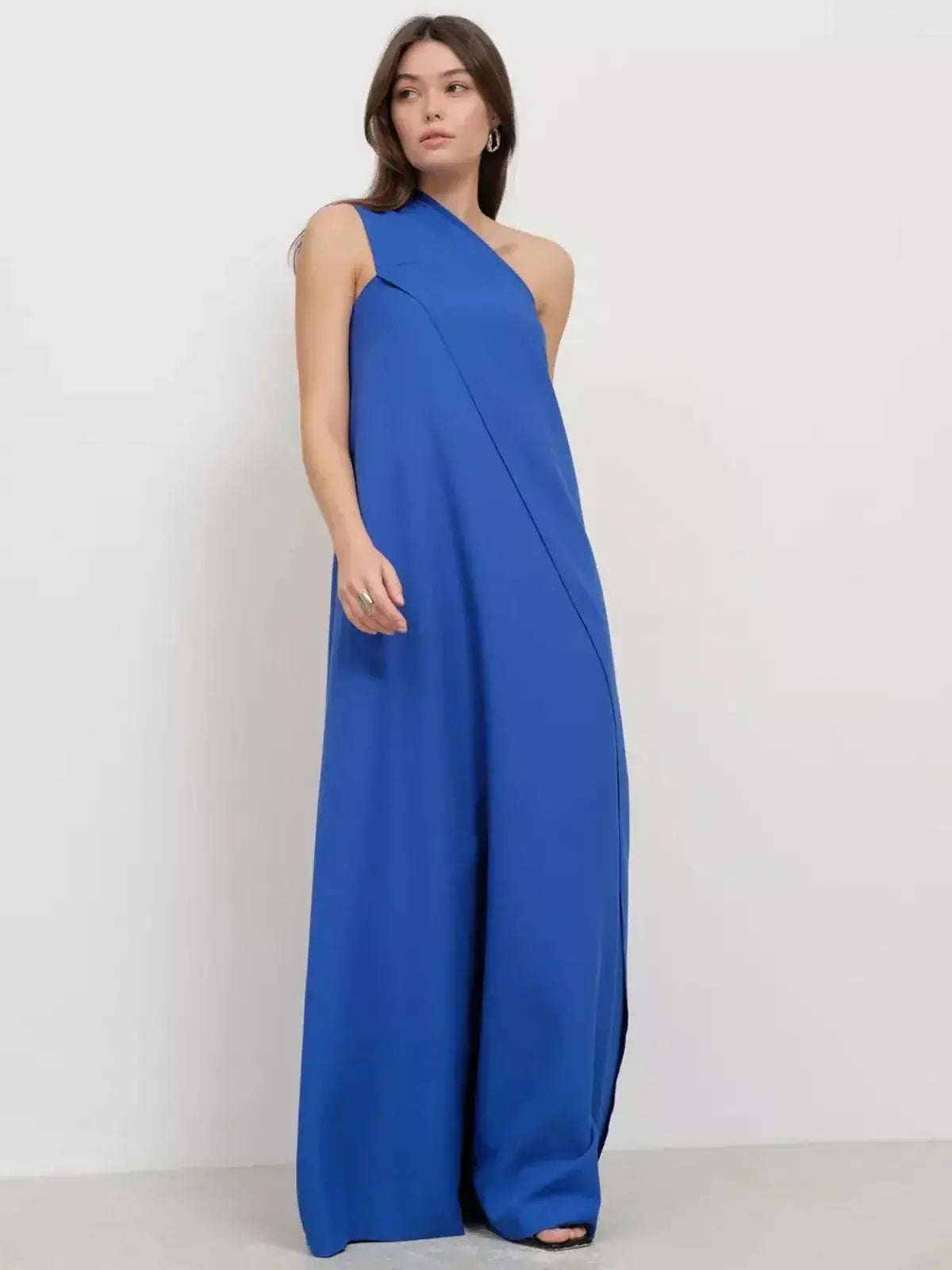 Cerulean Drape Maxi Dress featuring one-shoulder design, flowing silhouette, and elegant drape in rich sapphire hue.