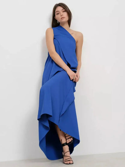 Cerulean Drape Maxi Dress featuring one-shoulder design, flowing silhouette, and elegant drape in rich sapphire blue.