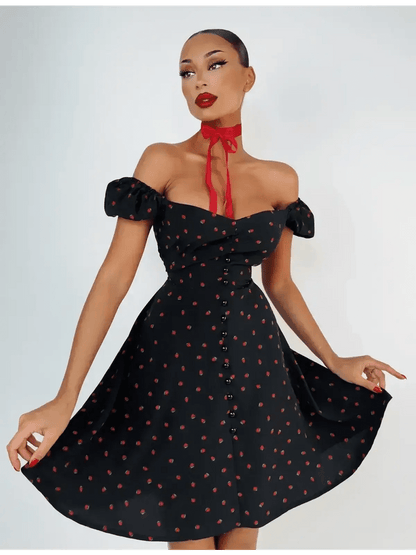 Cherry Kiss Mini Dress featuring cherry print, sweetheart neckline, and puff sleeves, perfect for summer occasions.