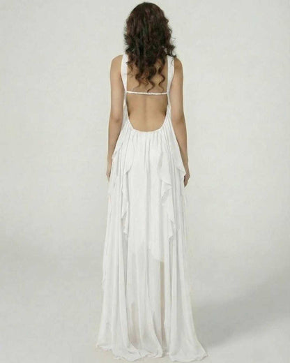 Back view of a model wearing the Clariona Maxi Dress by Lauven, showcasing ruffle details and a flowing silhouette.