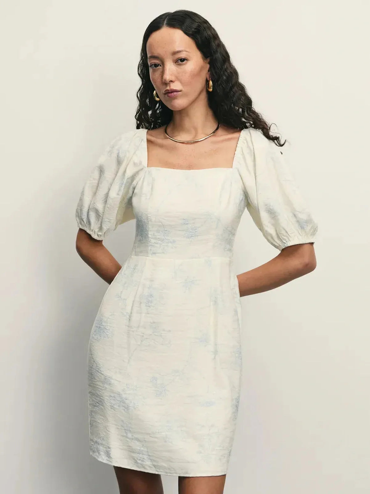 Elegant Cloud Bloom mini dress featuring a square neckline, puff sleeves, and a pale blue floral pattern.