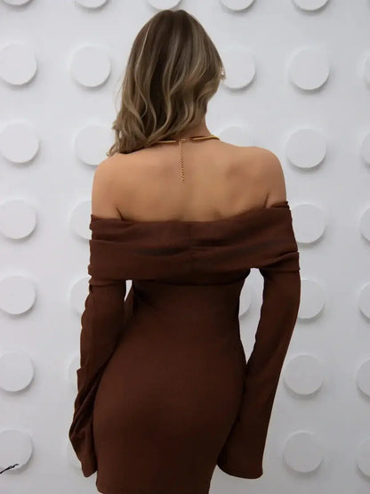 Back view of the Cocoa Charm mini dress, featuring an off-shoulder silhouette and flared sleeves in a rich chocolate hue.