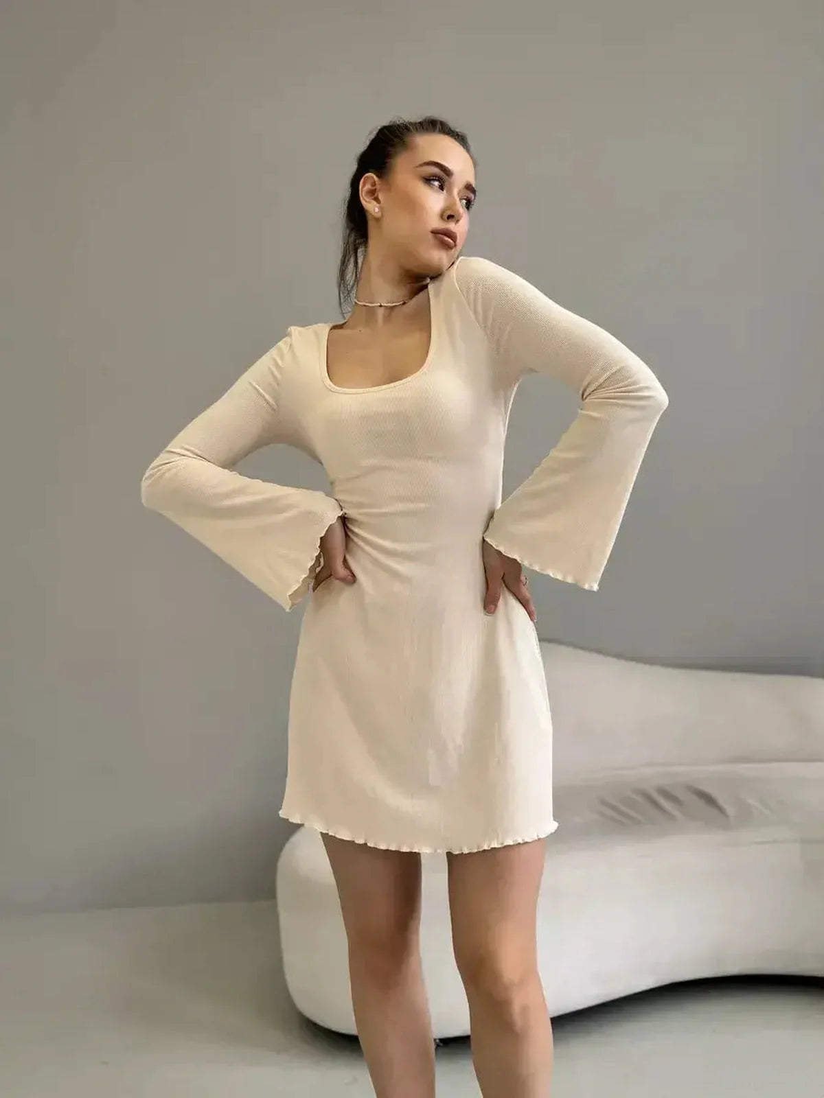Elegant fitted Cream Belle mini dress with long sleeves and a square neckline, perfect for weddings and formal events.