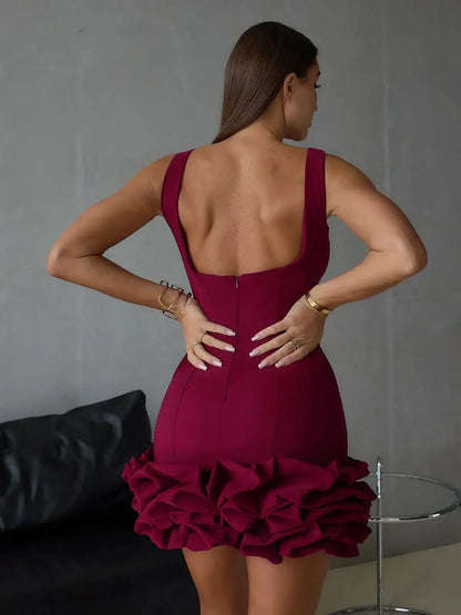 Back view of a model in a burgundy bodycon mini dress with ruffle hem, perfect for cocktail and prom occasions.