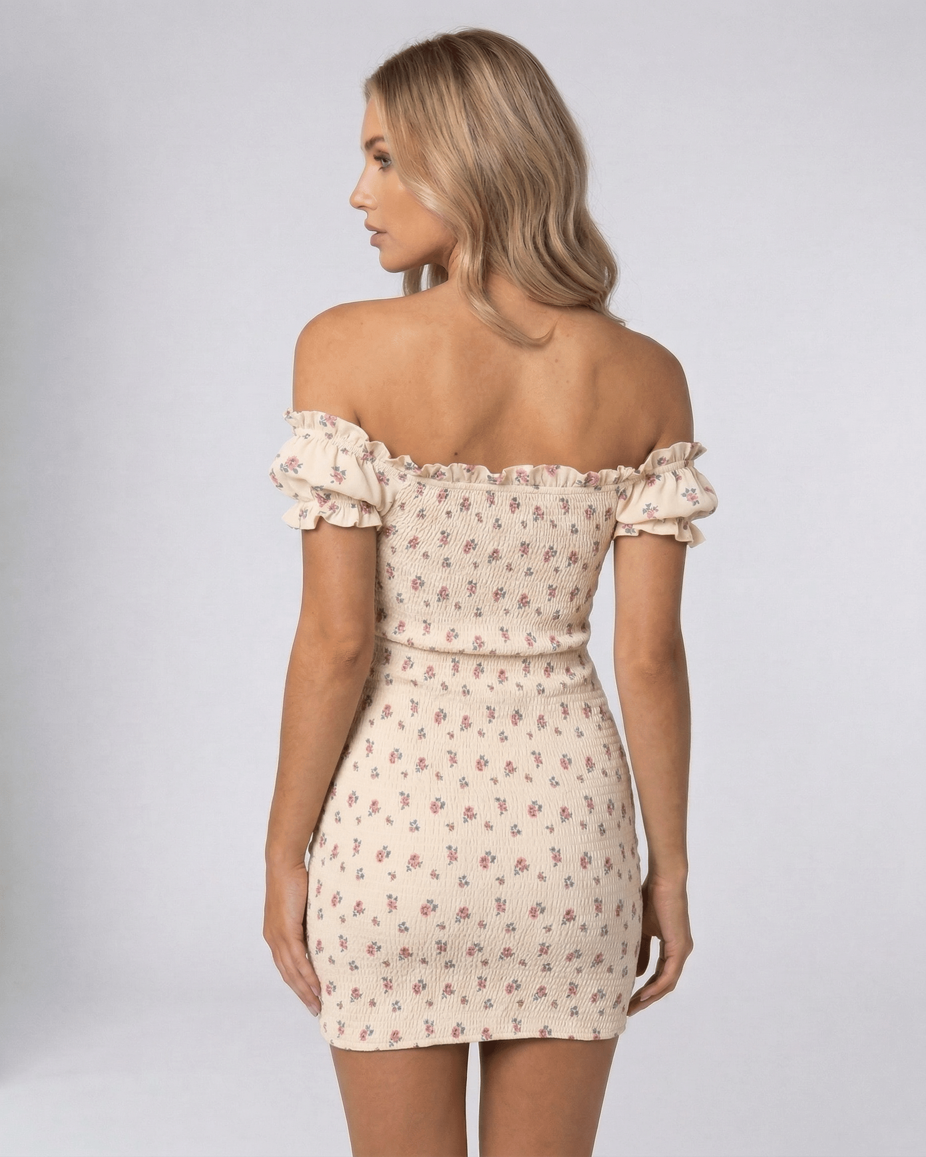 Dahlia Mini Dress by Lauven, off-shoulder design with floral print, showcasing a flattering silhouette from the back.