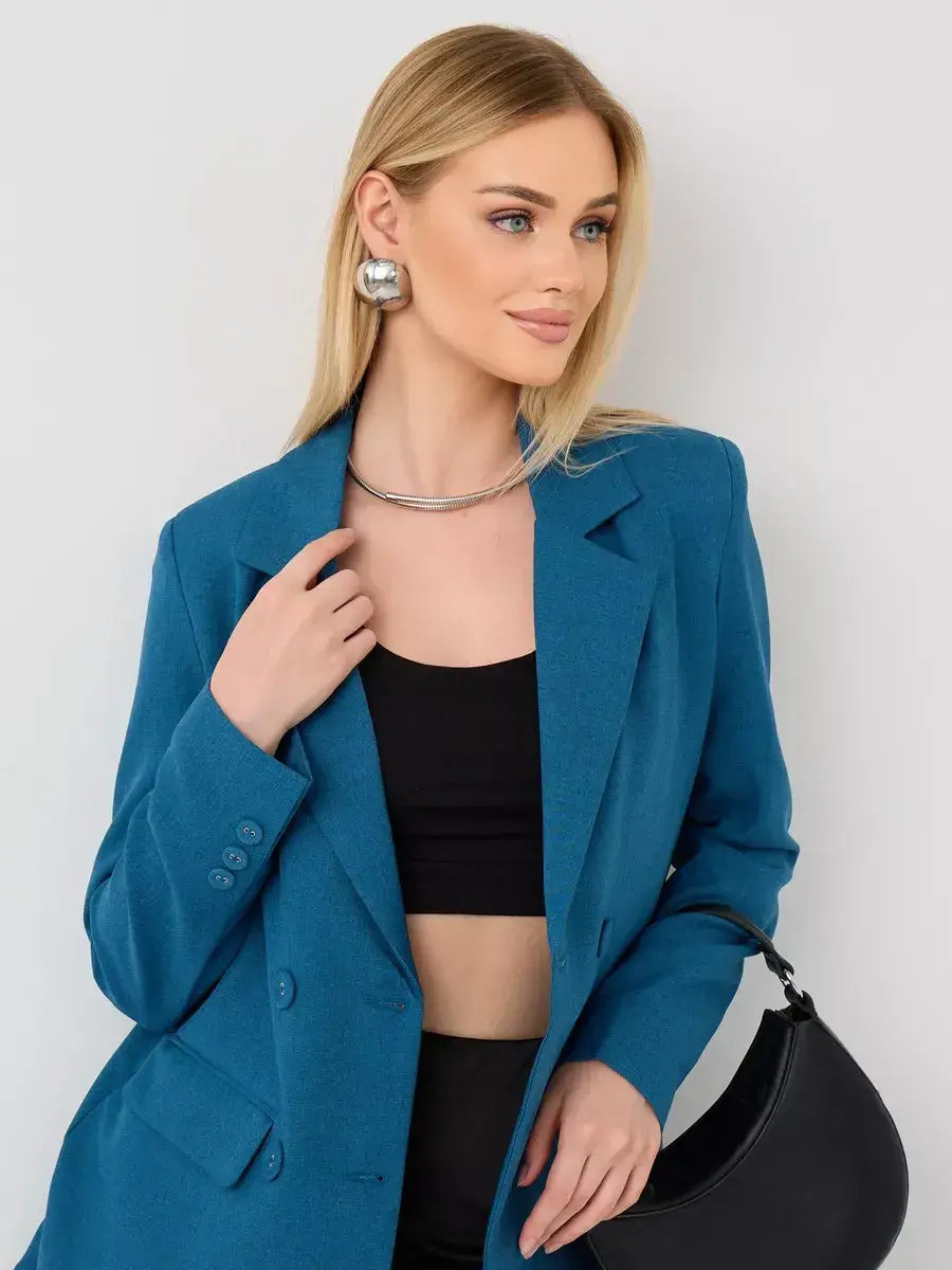 Model showcasing the Diana Blazer by Lauven, a classic cropped women's blazer in elegant blue.