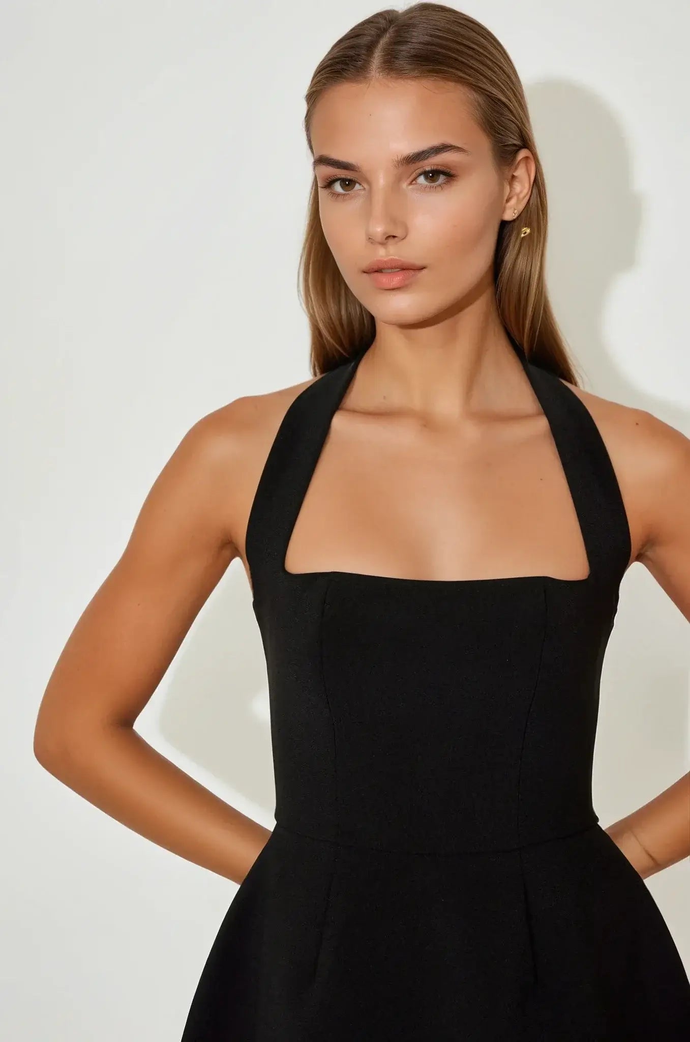 Elegant black halter neckline mini dress for women, perfect for weddings, parties, or formal occasions.