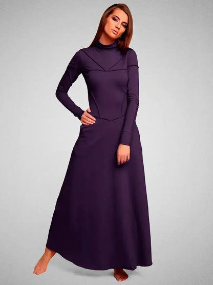 Model showcasing the Eclipse Maxi Dress in dark violet, featuring a sculpted silhouette and elegant seam detailing.