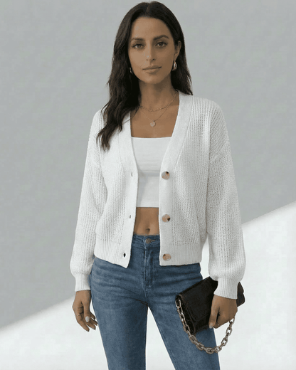 Elara Cardigan by Lauven, lightweight button-front knitwear in white, styled with jeans and a black bag.