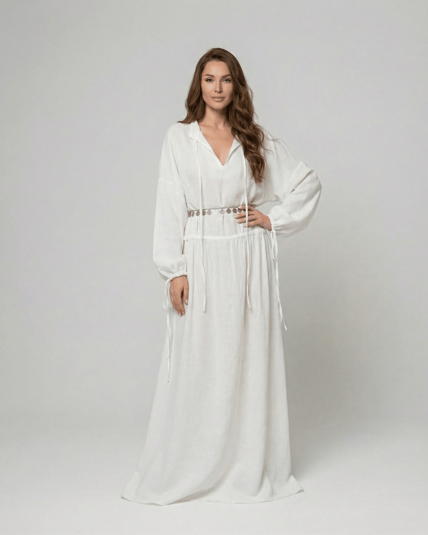 Elara Maxi Dress by Lauven, a white cotton A-line maxi dress featuring adjustable waist and long sleeves.