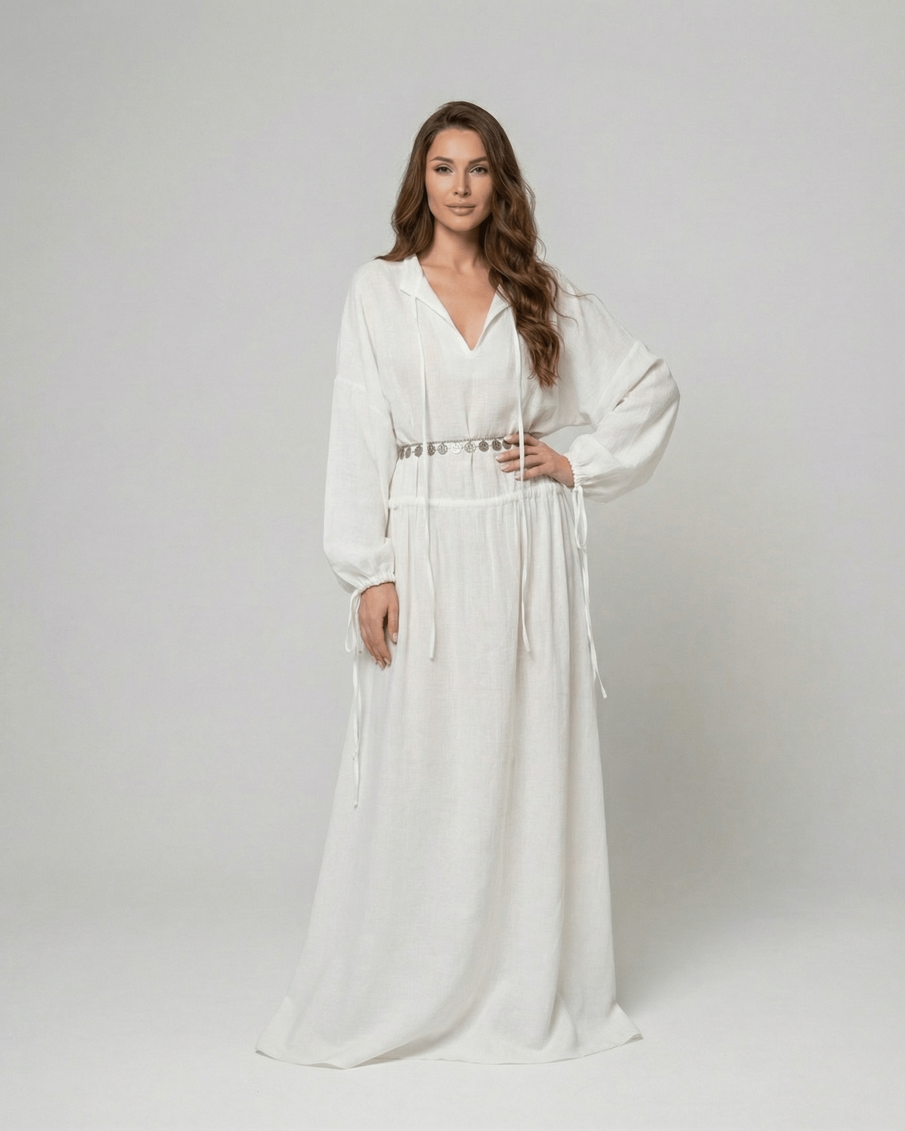 Elara Maxi Dress by Lauven, a white cotton A-line maxi dress featuring adjustable waist and long sleeves.