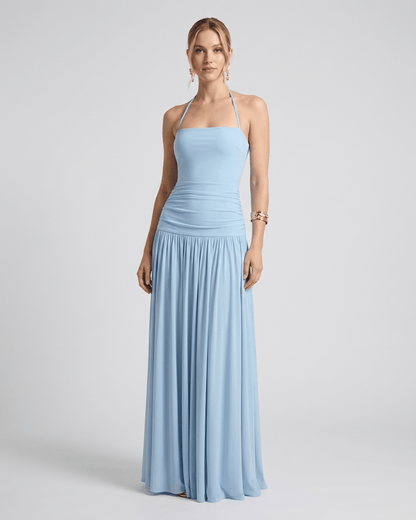 Elara Maxi Dress in soft blue, featuring stretch jersey, halter neck, and flowing full-length skirt by Lauven.
