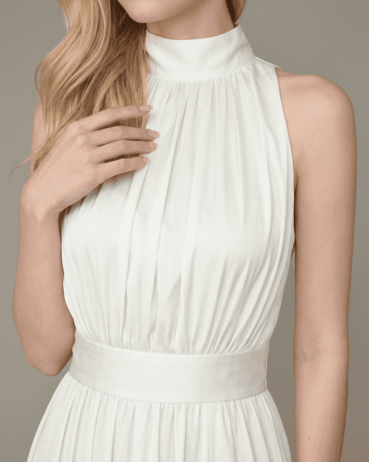 Elara Maxi Dress by Lauven showcasing the elegant sleeveless turtleneck and pleated design in a smooth white finish.