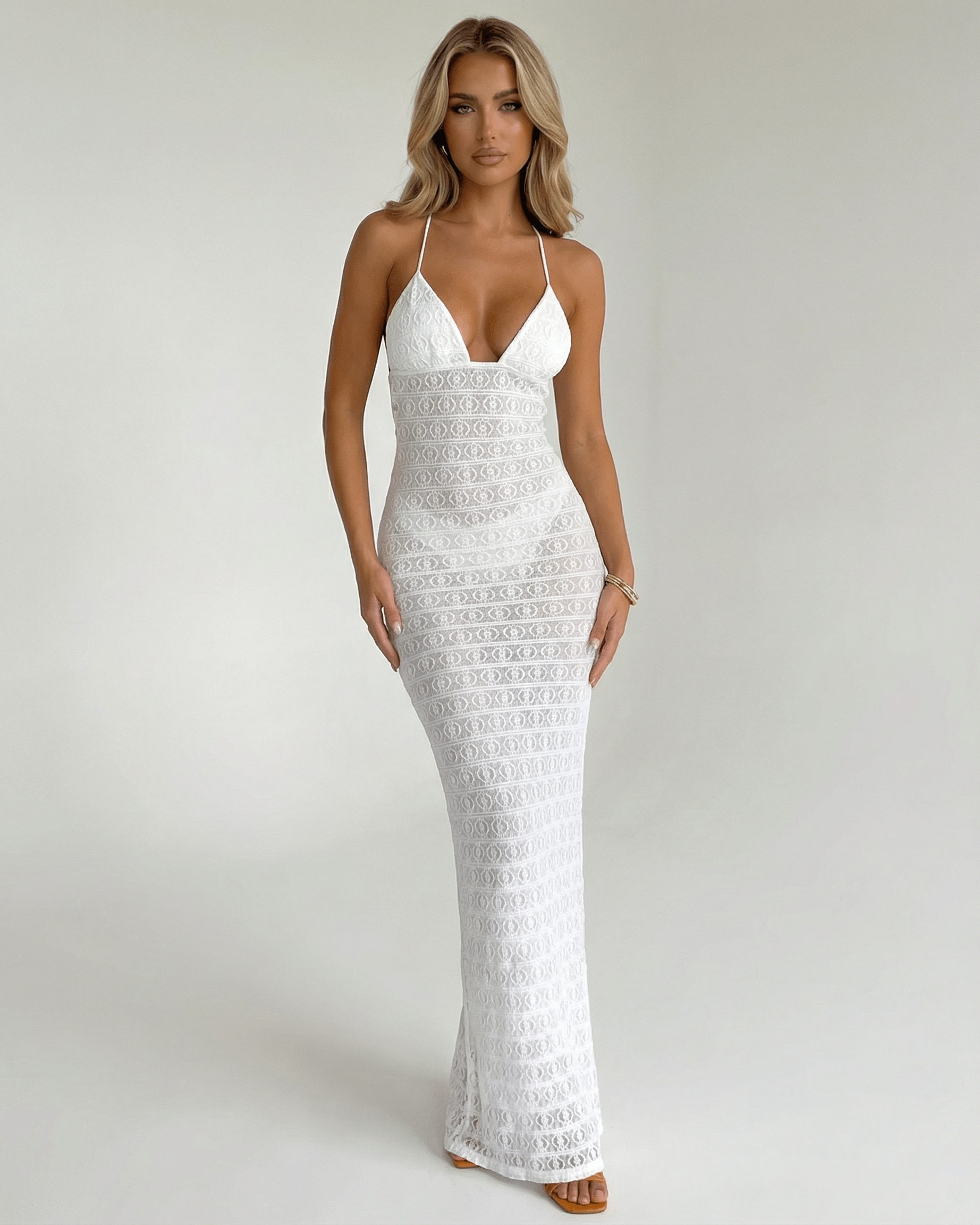Elara Maxi Dress by Lauven: Elegant white lace V-neck halter dress featuring a sleek silhouette and delicate design.