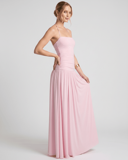 Elara Maxi Dress in pink, featuring stretch jersey, halter neck, ruched waist, and an elegant flow by Lauven.