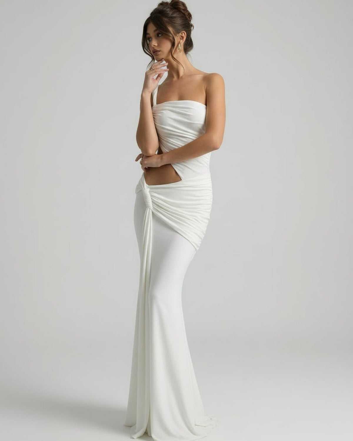 Elara Maxi Dress - White dress with asymmetrical draping and backless detail by Lauven, featuring a fluid silhouette.