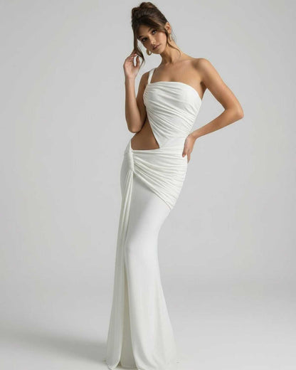 Elara Maxi Dress featuring asymmetrical draping, backless detail, and elegant floor-length silhouette by Lauven.