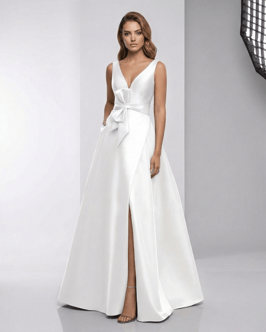 Elara Maxi Dress - white satin A-line gown with V-neck, bow detail, elegant floor-length silhouette by Lauven.