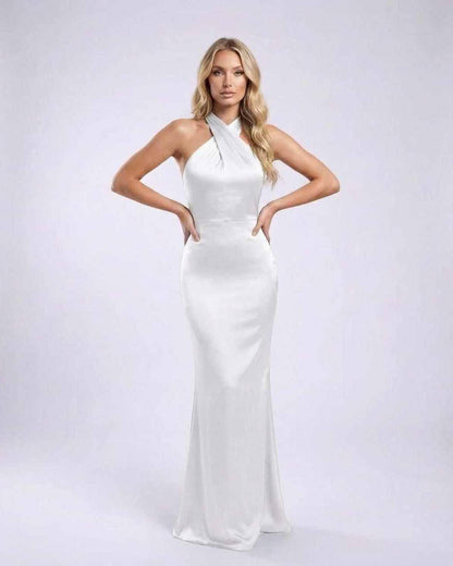 Elara Maxi Dress featuring a white satin finish, halter neck, open back, and elegant design by Lauven.