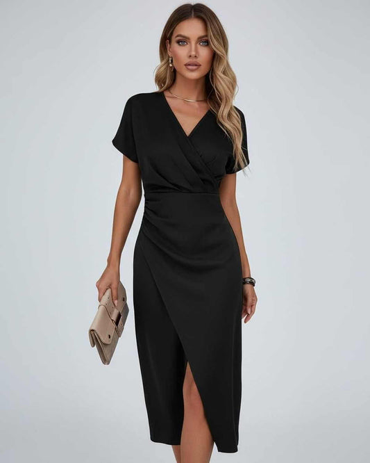 Elara Midi Dress by Lauven – Elegant black wrap dress featuring a modern feminine silhouette.