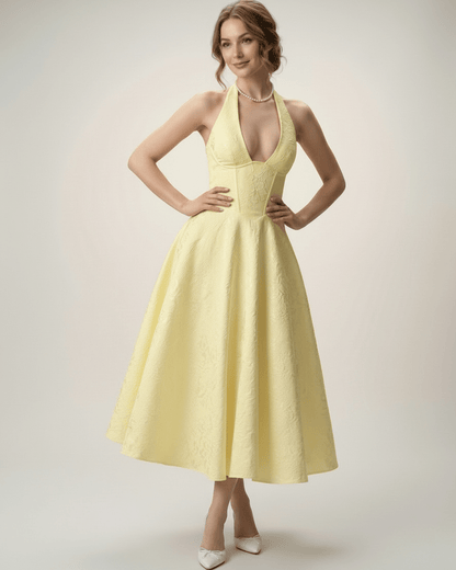 Elara Midi Dress in elegant yellow, featuring a halter A-line silhouette with structured fit by Lauven.