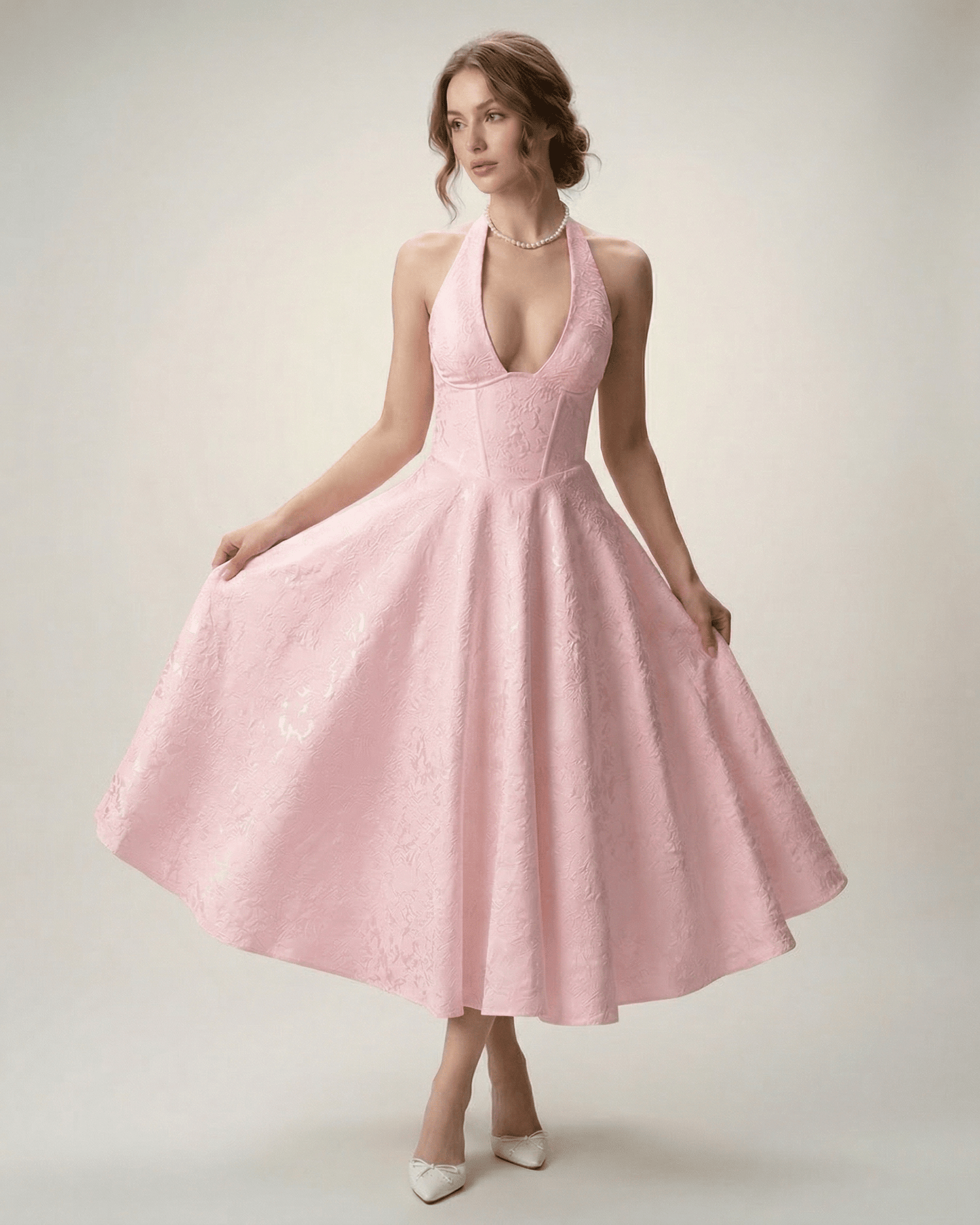 Elara Midi Dress in pink, featuring a halter neckline and A-line silhouette, designed by Lauven for a sophisticated look.