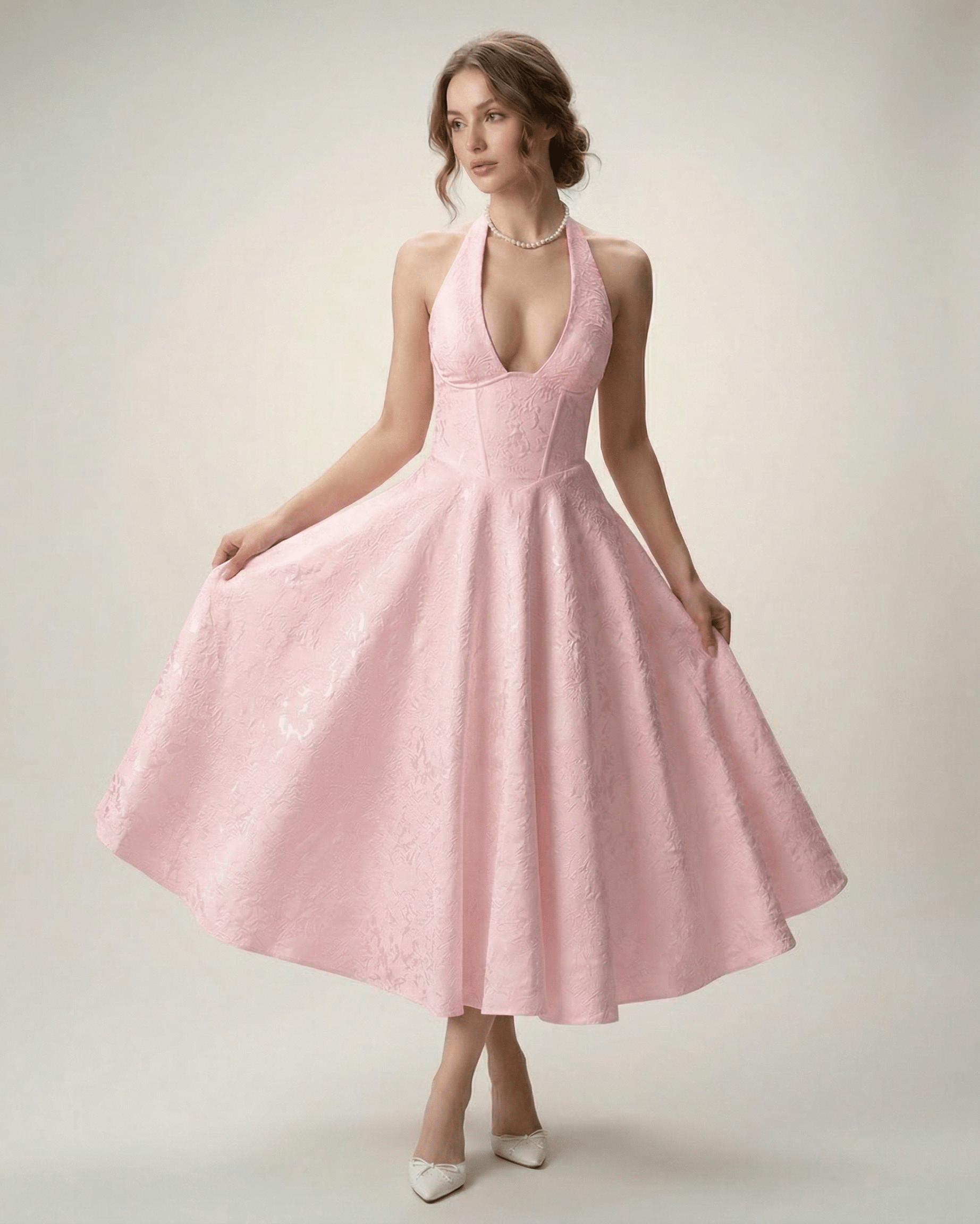 Elara Midi Dress in pink, featuring a halter neckline and A-line silhouette, designed by Lauven for a sophisticated look.