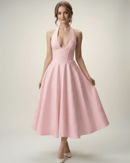 Elara Midi Dress in soft pink, featuring a halter neckline, A-line silhouette, and structured fit by Lauven.