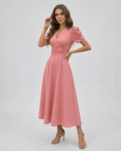 Elara Midi Dress in soft pink with puffed sleeves and V-neckline, perfect for weddings and elegant occasions by Lauven.
