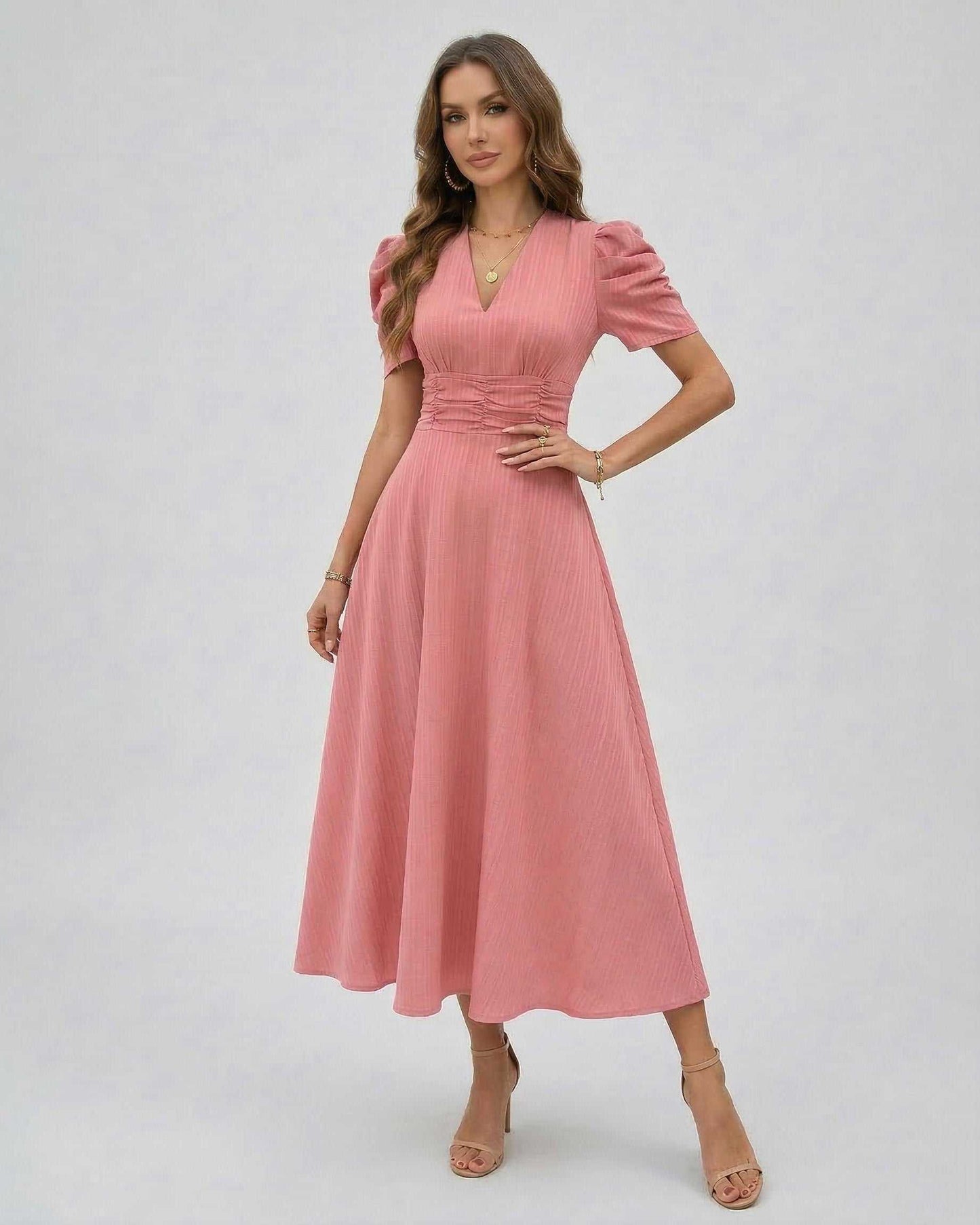 Elara Midi Dress features soft pink fabric, V-neckline, puffed sleeves, and a cinched waist for elegant occasions by Lauven.