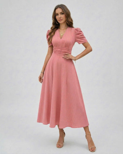 Elara Midi Dress features soft pink fabric, V-neckline, puffed sleeves, and a cinched waist for elegant occasions by Lauven.