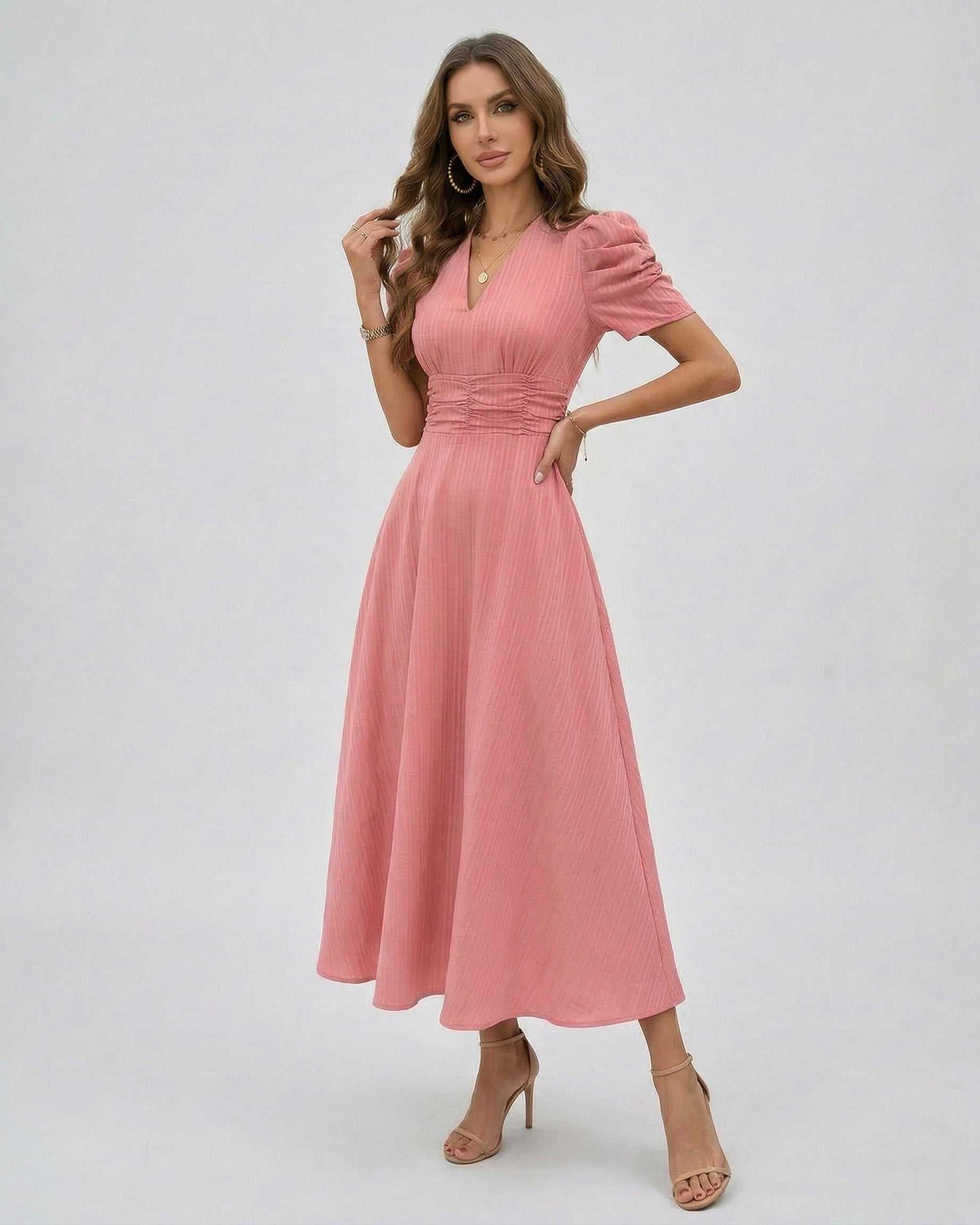 Elara Midi Dress in soft pink, featuring puffed sleeves and a cinched waist for a feminine silhouette by Lauven.