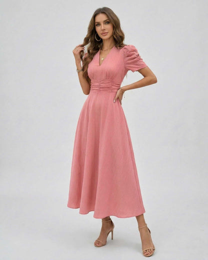 Elara Midi Dress in soft pink, featuring puffed sleeves and a cinched waist for a feminine silhouette by Lauven.
