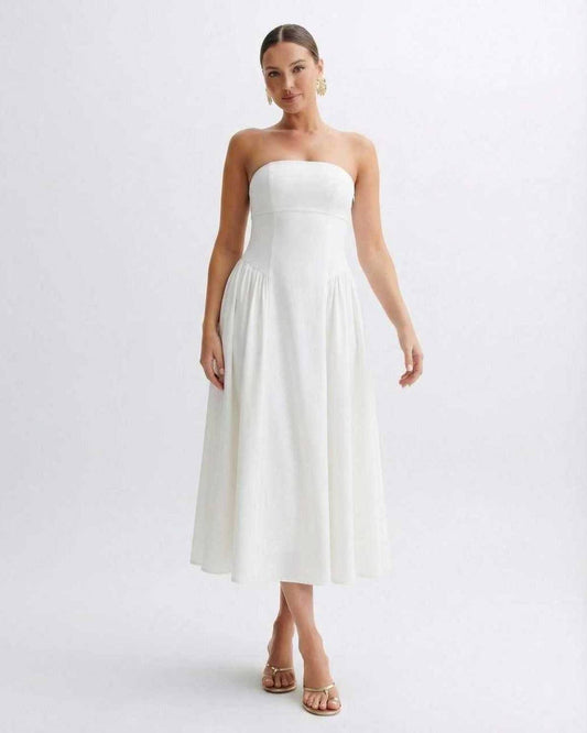 Elara Midi Dress by Lauven, a strapless white pleated dress with a clean bandeau neckline, capturing timeless elegance.