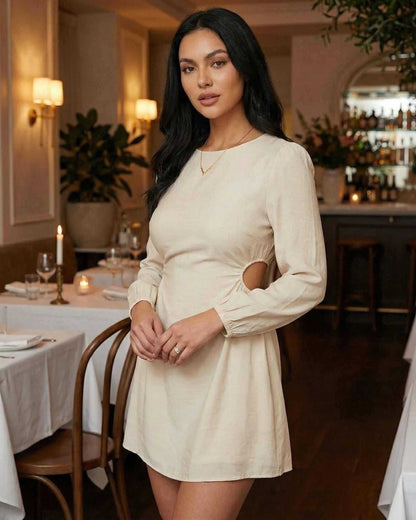 Elara Mini Dress by Lauven featuring a long sleeve A-line silhouette with cut-out detail in a stylish setting.