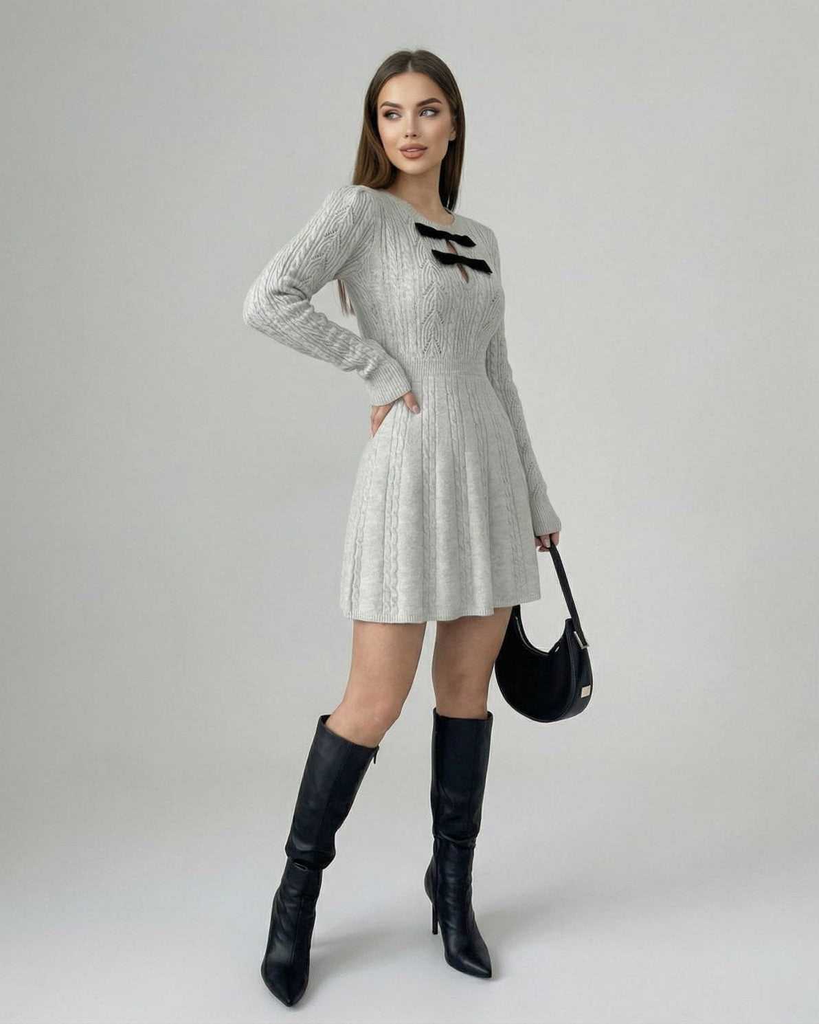 Elara Mini Dress by Lauven, featuring long sleeves, knitted texture, and bow detail, perfect for stylish occasions.