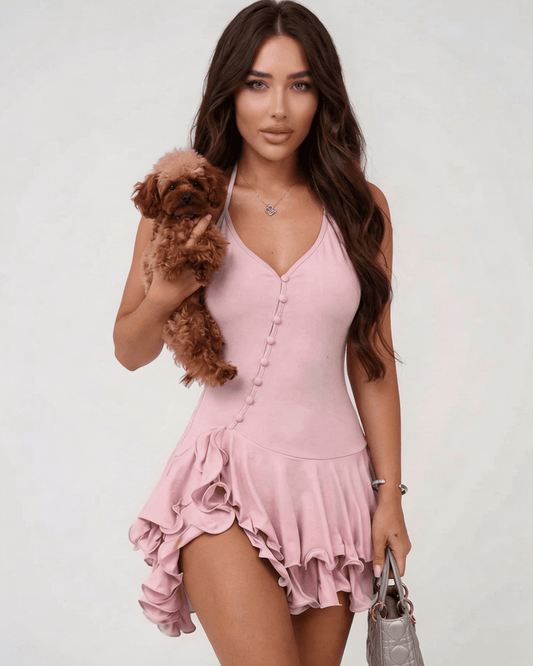 Elara Mini Dress by Lauven, pink ruffle hem halter neck dress, styled with a small dog.