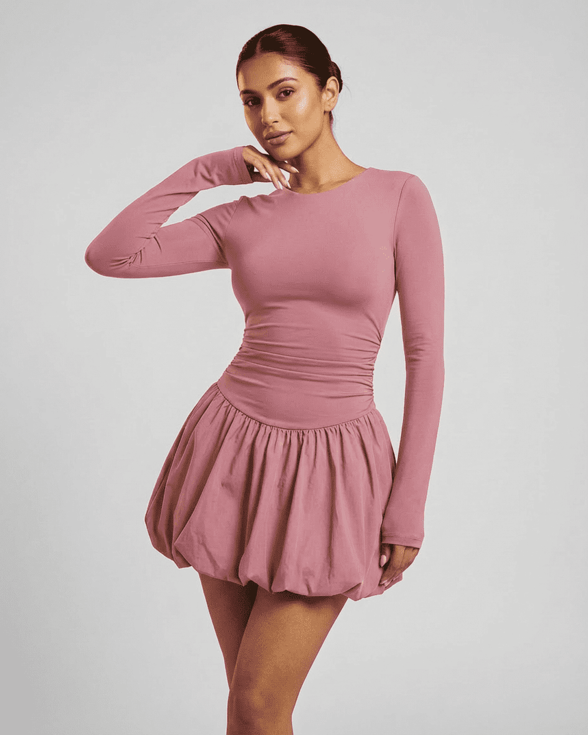 Elara Mini Pink - Elegant long sleeve tiered mini dress by Lauven, showcasing a fitted, stretchy design.