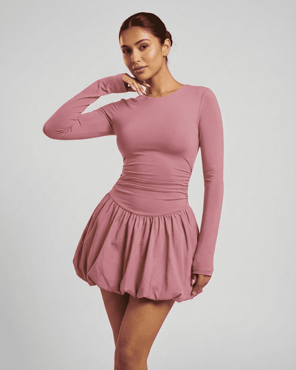 Elara Mini Pink - Elegant long sleeve tiered mini dress by Lauven, showcasing a fitted, stretchy design.