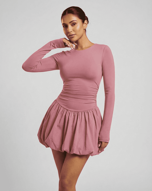 Elara Mini Pink - Elegant long sleeve tiered mini dress by Lauven, showcasing a fitted, stretchy design.