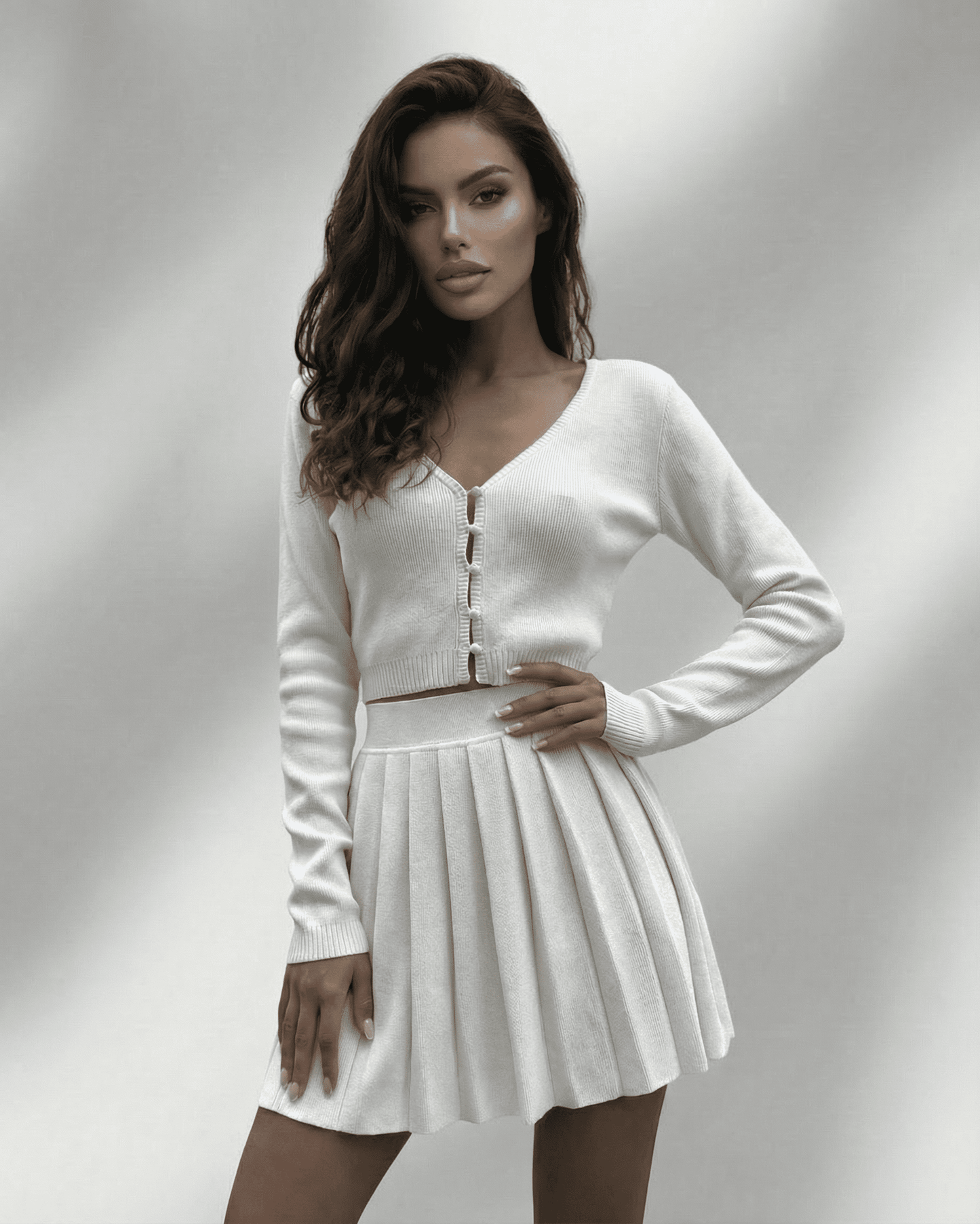 Elara Two-Piece Set featuring Lauven brand, stylish knit cardigan and pleated mini skirt ensemble in white.
