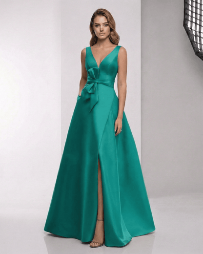 Elaria Maxi Dress showcasing a green satin A-line design with wrap slit, bow waist, and elegant V-neckline by Lauven.