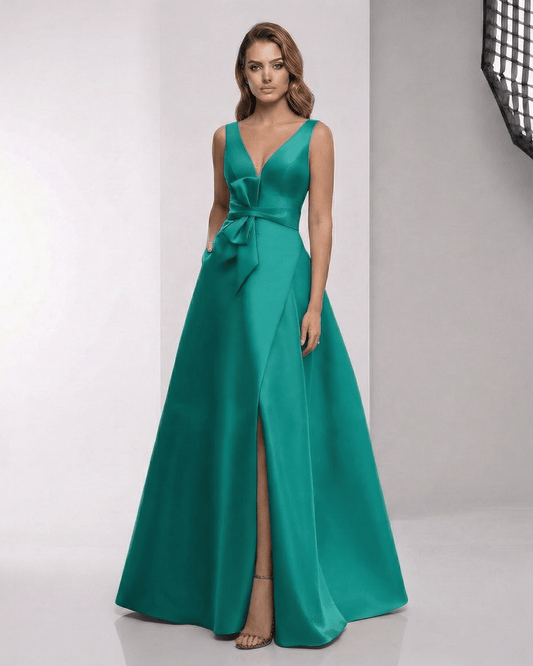 Elaria Maxi Dress showcasing a green satin A-line design with wrap slit, bow waist, and elegant V-neckline by Lauven.