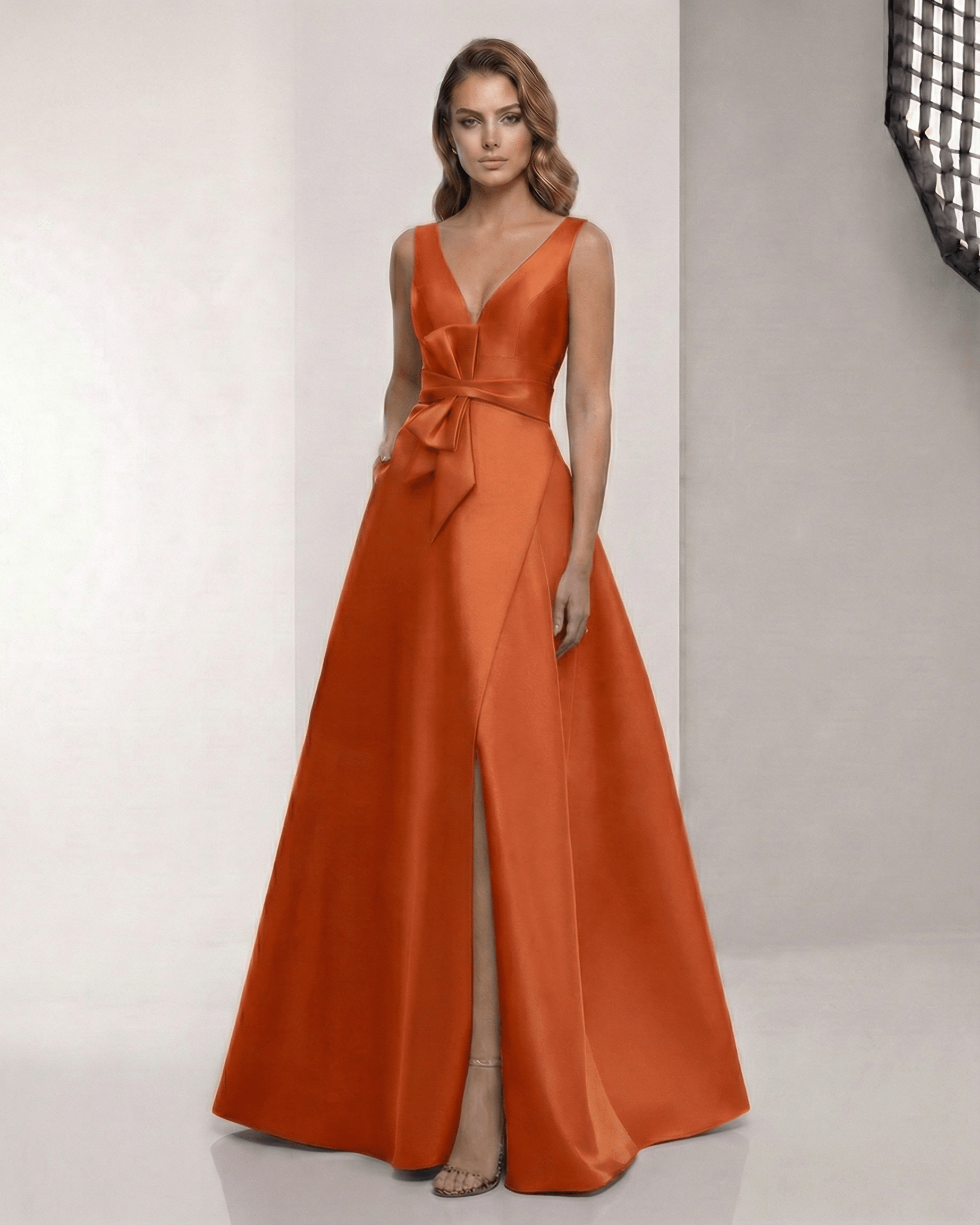 Elaris Maxi Dress - Elegant orange satin dress with A-line silhouette, wrap slit, and bow waist by Lauven.