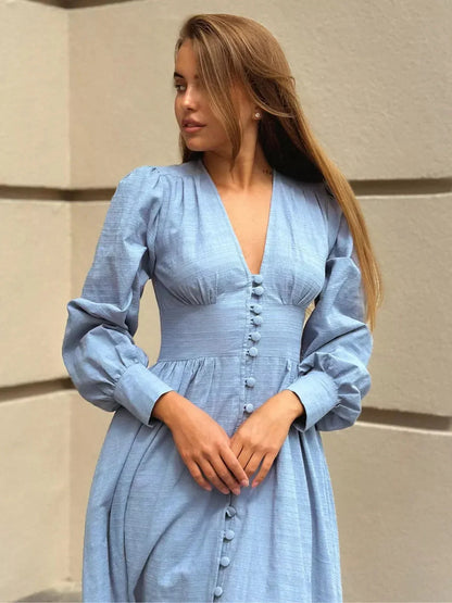 Azure Grace Maxi Dress in light blue with button detail and flowy silhouette, ideal for summer elegance.