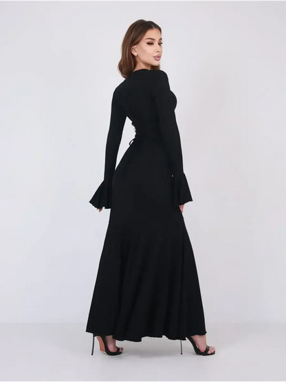 Mirage Maxi Dress in black featuring elegant flared cuffs and a flowing fishtail hem, perfect for evening wear.