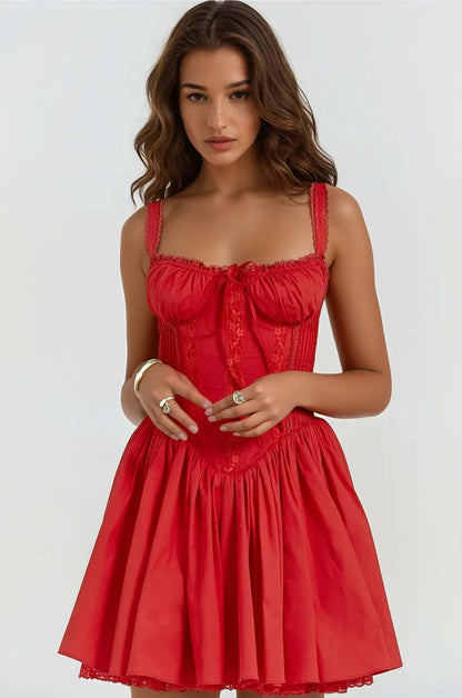Model wearing a red Opal Mini Dress, featuring a fitted bodice and flowing skirt, ideal for summer or cocktail occasions.