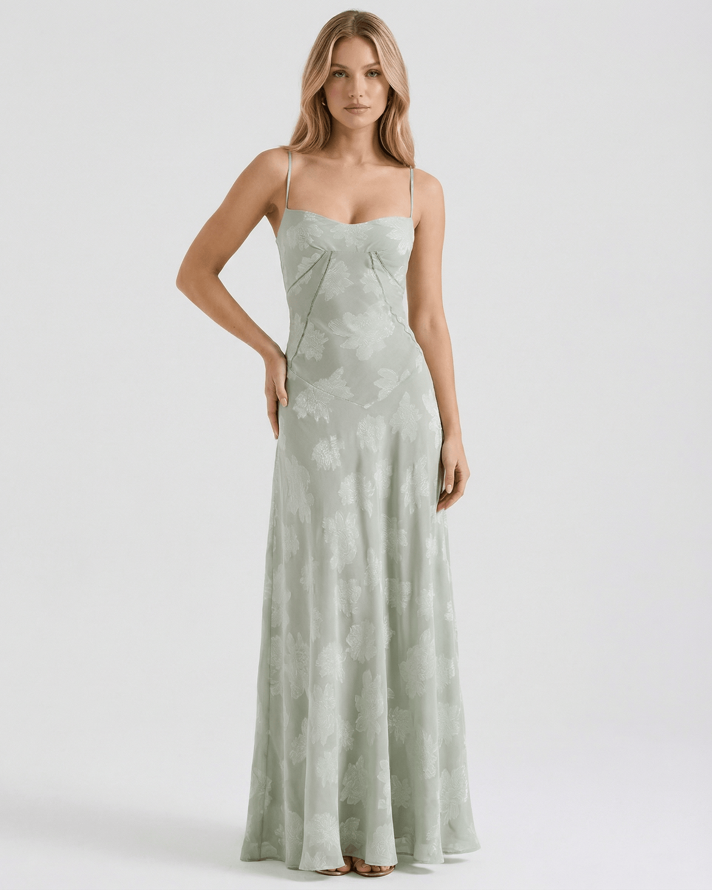 Eliara Maxi Dress by Lauven, featuring a floral print, sheer fabric, and a graceful silhouette in soft sage-green.